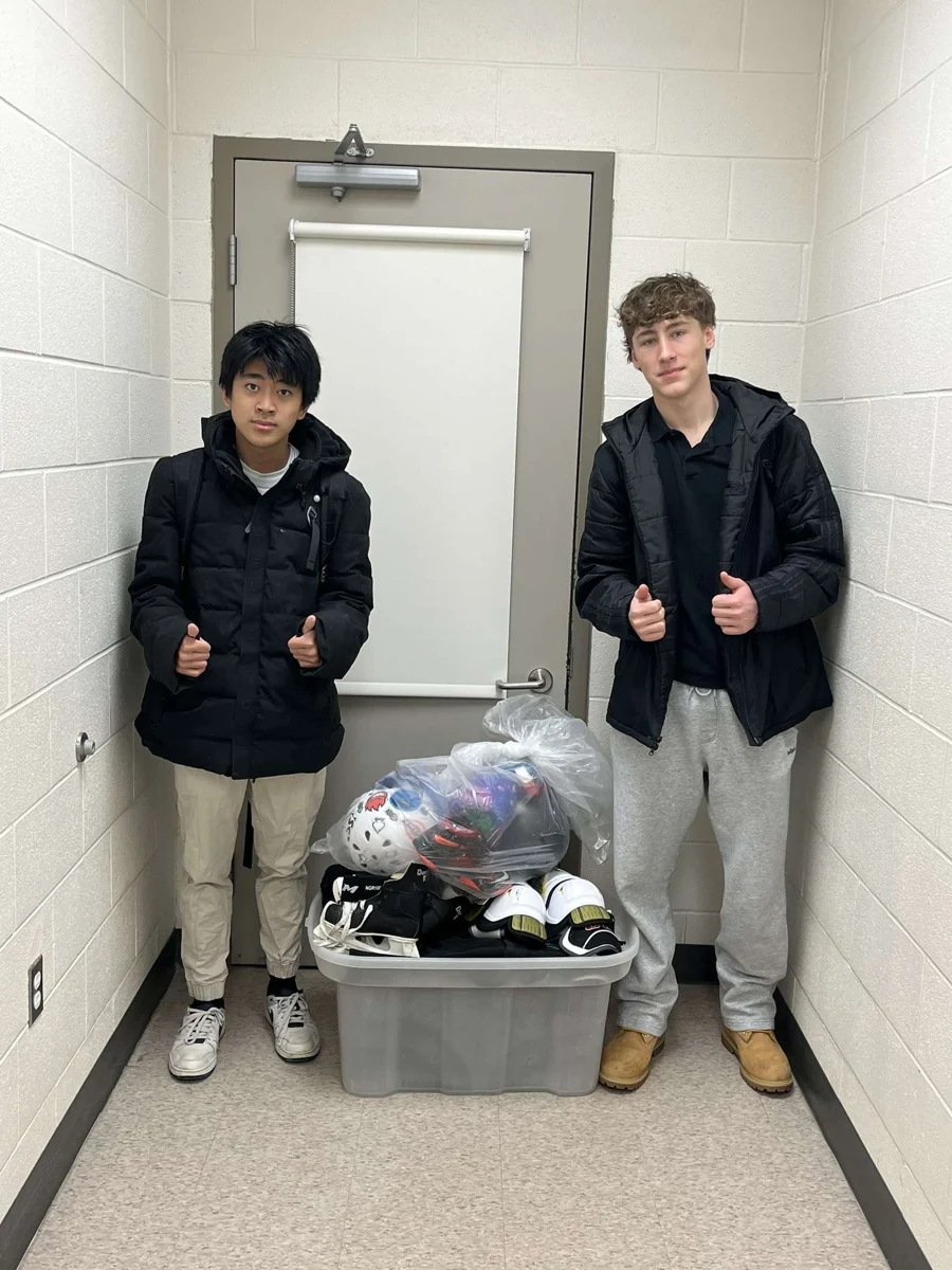 Two volunteers with equipment collected at Stouffville Secondary School